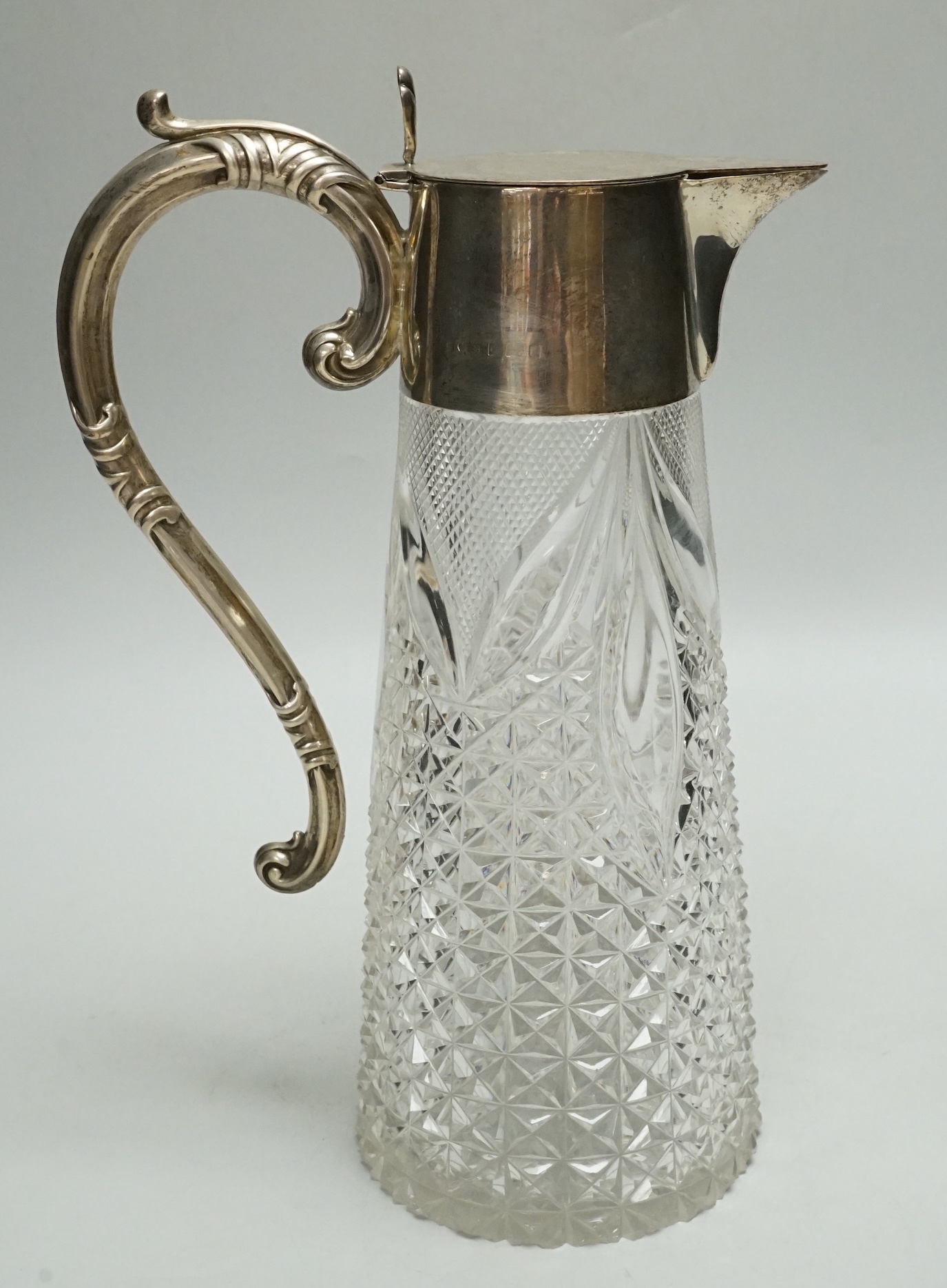 An Edwardian silver mounted cut glass claret jug, WHS, Birmingham, 1901, 26cm.